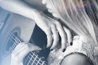 Midsection of couple kissing hands