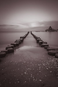 Bridge over sea against sky