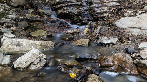 High angle view of water flowing through rocks