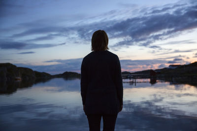 Silhouette of woman at sea