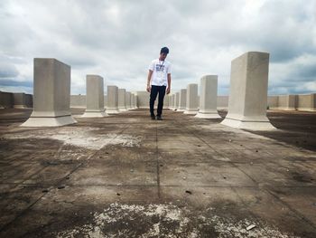 Full length of man standing on concrete structure