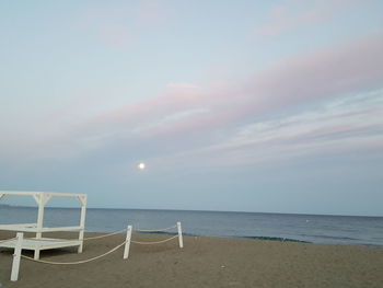 Scenic view of beach against sky during sunset