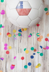 Close-up of soccer ball on wooden wall