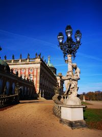 Statue against blue sky