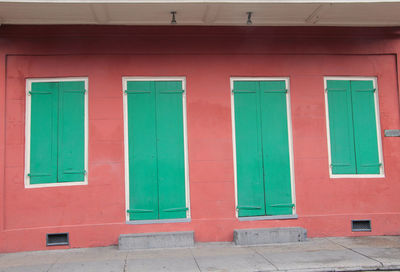 Blue window on wall of building