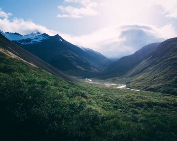 Scenic view of landscape and mountains against sky