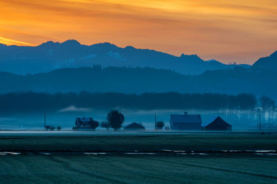 Scenic view of mountains against sky during sunset