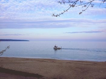 Scenic view of sea against cloudy sky