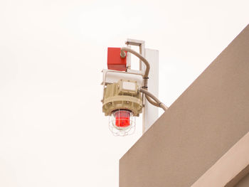 Low angle view of electric lamp against white background