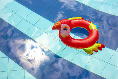 High angle view of toy floating on swimming pool