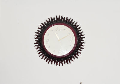 Close-up of clock on white background