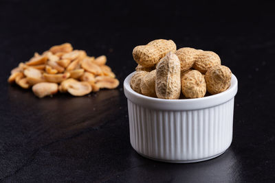 Close-up of sweet food on table against black background