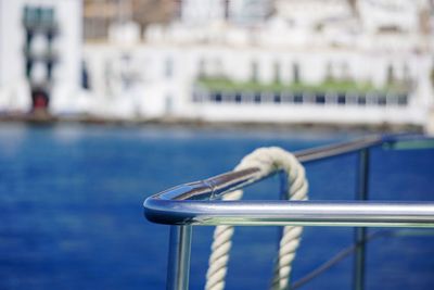 Close-up of railing against sea