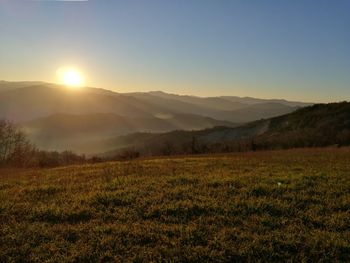 Scenic view of landscape against sky during sunset