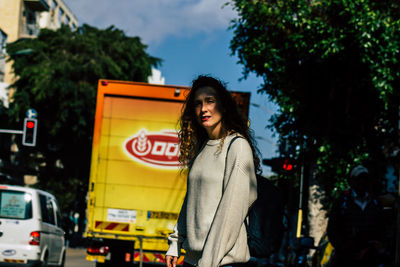 Full length of man standing on street in city