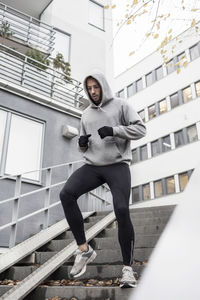 Sporty man moving down stairs