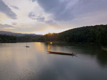 Scenic view of lake against sky during sunset