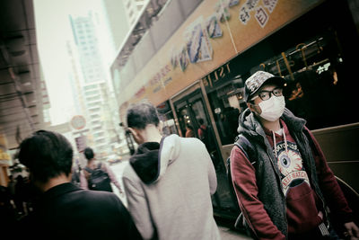 Group of people standing in front of buildings