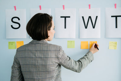 Business planning strategy. businesswoman, manager standing in office in front of the chart white