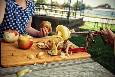 Midsection of woman preparing food on table