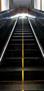 Low angle view of escalator in subway station