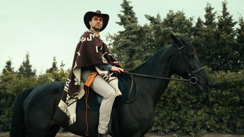 Portrait of woman riding horse