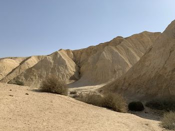 Scenic view of desert against clear sky