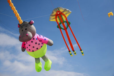 A jellyfish and hippopotamus kite flying in the sky at southsea international kite festival