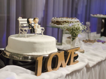 Close-up of wedding cake on table