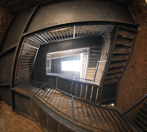 Low angle view of spiral staircase in building