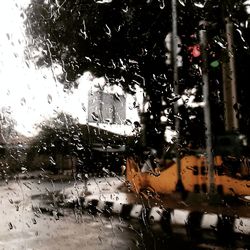 Full frame shot of wet glass window in rainy season