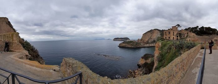 Panoramic view of sea and buildings against sky