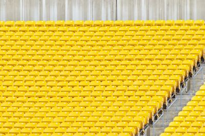 High angle view of yellow chairs in stadium