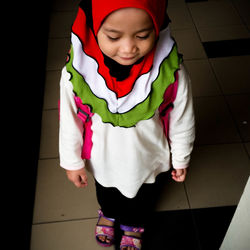 High angle view of cute girl in traditional clothing