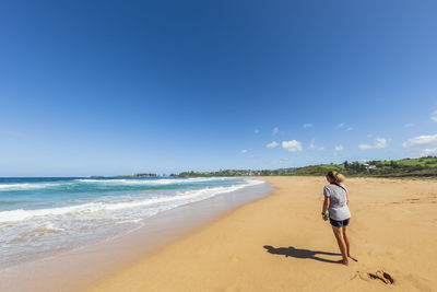 Full length of man on beach against sky