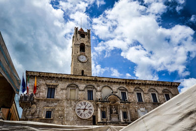 Low angle view of church against cloudy sky