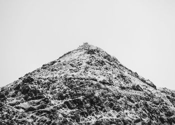 Low angle view of mountain against clear sky