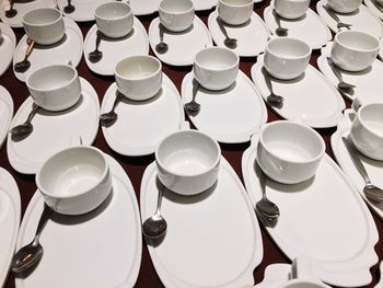 Full frame shot of plates and bowls arranged on table