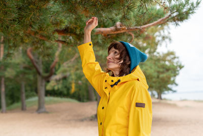 Full length of woman standing on yellow land