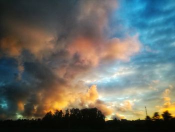 Low angle view of dramatic sky during sunset