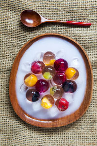 Directly above shot of fruit jelly dessert served in plate on table
