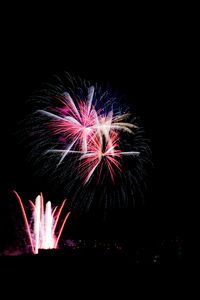 Low angle view of firework display at night