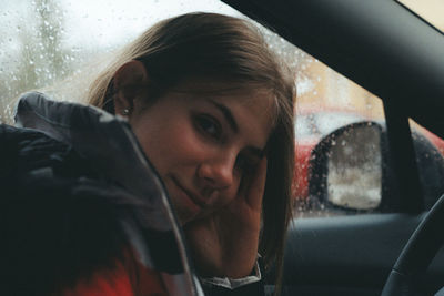 Portrait of woman in car