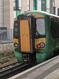 Train on railroad track in city