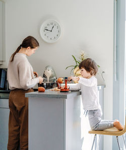 Rear view of friends standing at table