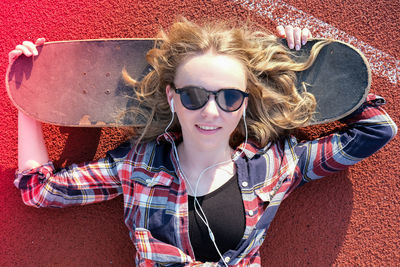 Portrait of young woman wearing sunglasses