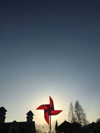Low angle view of silhouette trees against clear sky