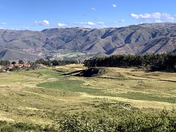 Scenic view of landscape and mountains against sky