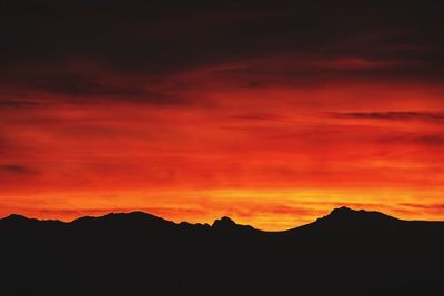 Scenic view of mountains at sunset