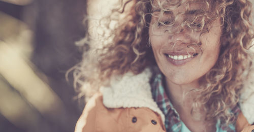 Close-up portrait of smiling young woman